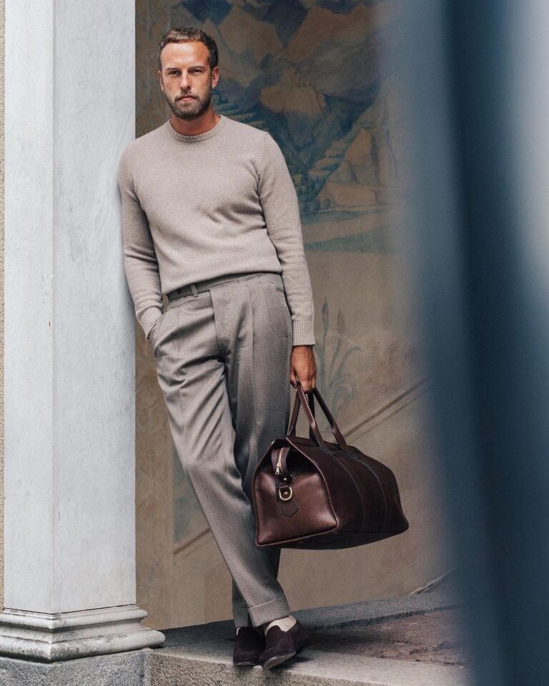 Instagram Old Money Style influencer Andreas Weinås with a leather duffel bag