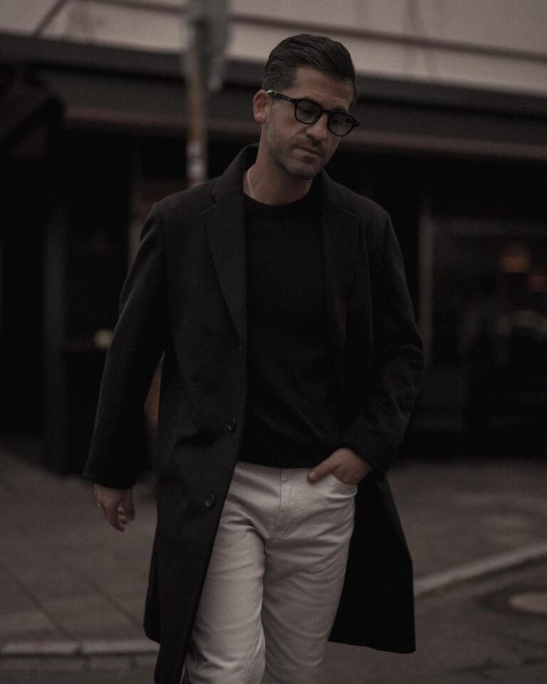 Instagram Old Money aesthetic influencer Kosta Williams in a casual black and ecru outfit