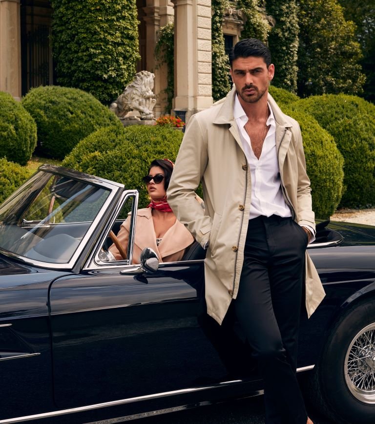 Michele Morrone models for Guess in an Old Money Style men's jacket outside a mansion