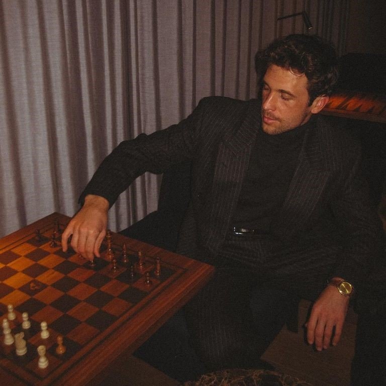 Denis Cebulec Playing Chess in An Old Money Style men's striped Suit